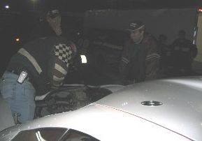 Crew working on the car after the race