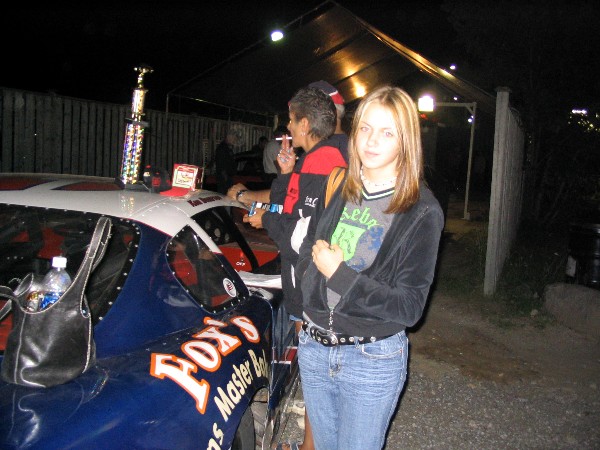 Krista standing by the car after our feature win